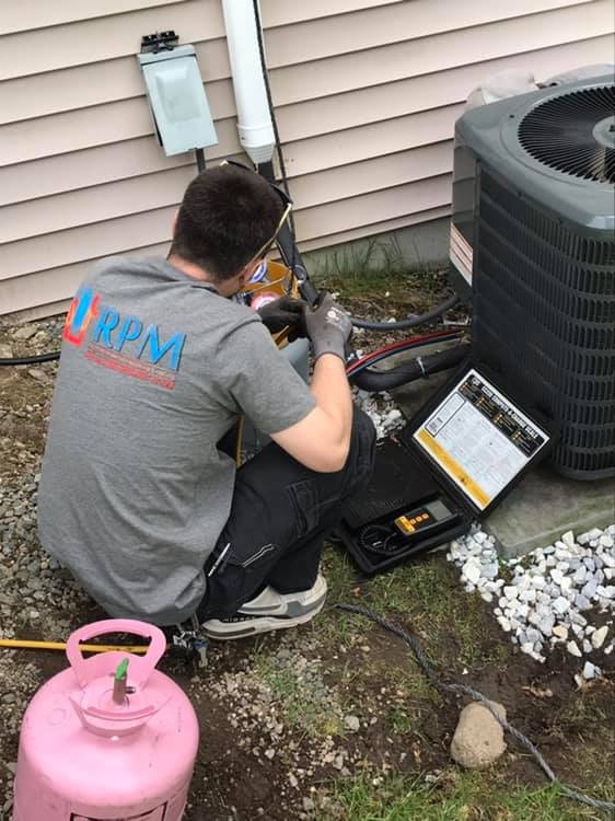 RPM technician servicing an outdoor unit